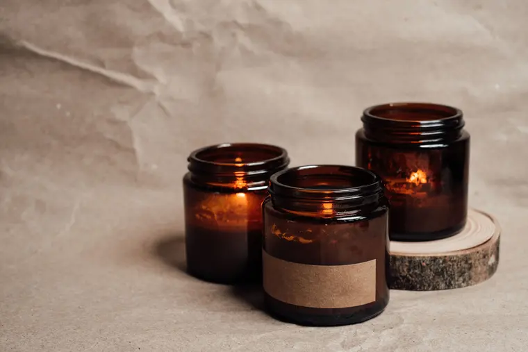 

Lighted Candles in Glass Containers