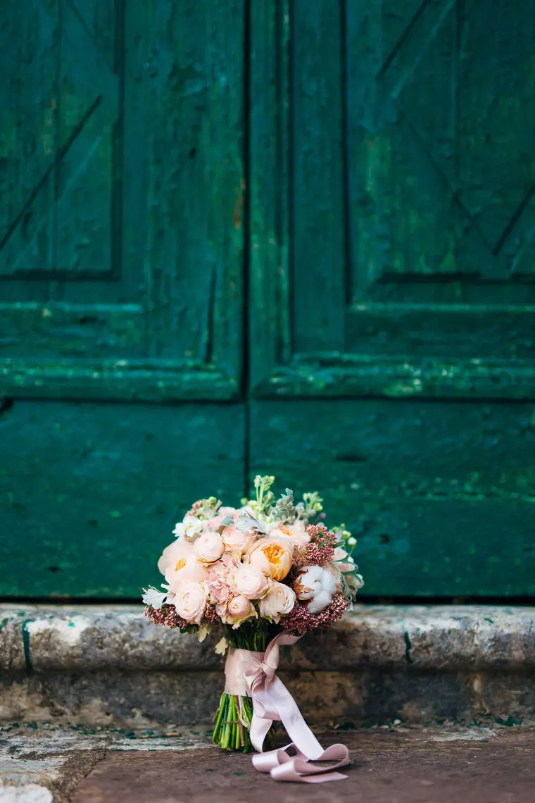 Elegant Wedding Bouquet Against Rustic Door